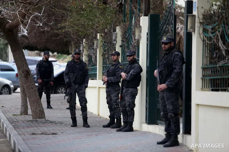 Palestinian policemen stand guard during a visiting of the Quartet Representative to the Middle East and former British Prime Minister, Tony Blair, in Gaza city on February 15, 2015. Blair is in Gaza for meetings with of...