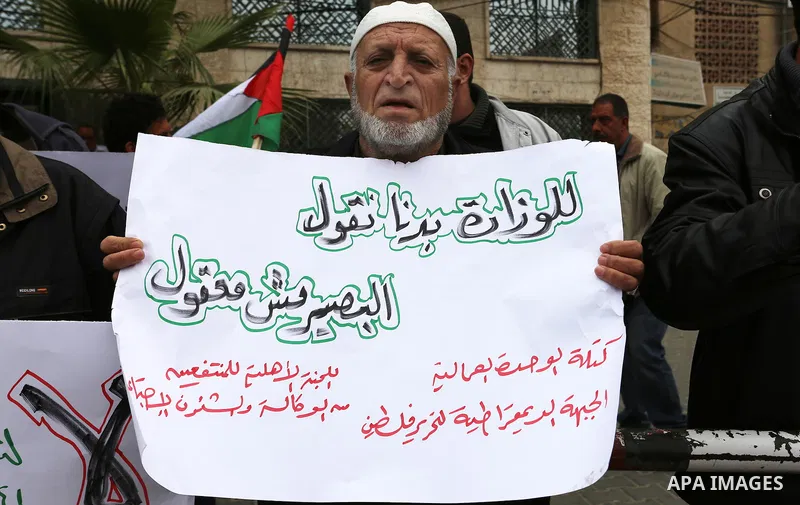 Palestinians with limited-income take part in a demonstration calling the Ministry of social affairs to pay their allocations and providing social assistance, in Rafah in the southern Gaza Strip, February 15, 2015. The P...