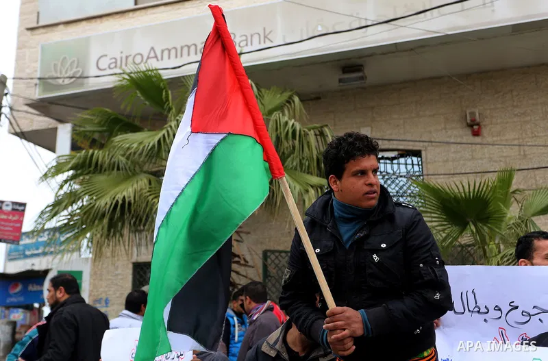 Palestinians with limited-income take part in a demonstration calling the Ministry of social affairs to pay their allocations and providing social assistance, in Rafah in the southern Gaza Strip, February 15, 2015. The P...