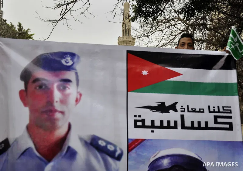 Egyptian supporters of the Wafd Party take part during a protest to show solidarity with the Jordanian pilot Muath al-Kasaesbeh, who was died by the hardline group, in front of American Embassy, in Cairo February 15, 201...