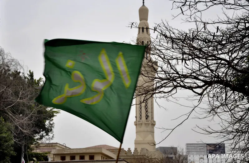 Egyptian supporters of the Wafd Party take part during a protest to condemn Chapel Hill shooting victims, the three young Muslims who were gunned down in North Carolina this week, in front of American Embassy, in Cairo F...
