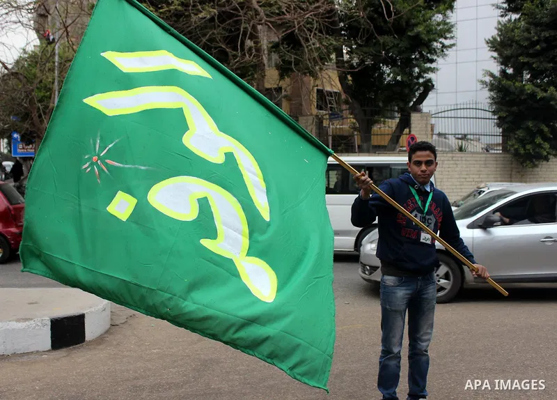 Egyptian supporters of the Wafd Party take part during a protest to condemn Chapel Hill shooting victims, the three young Muslims who were gunned down in North Carolina this week, in front of American Embassy, in Cairo F...