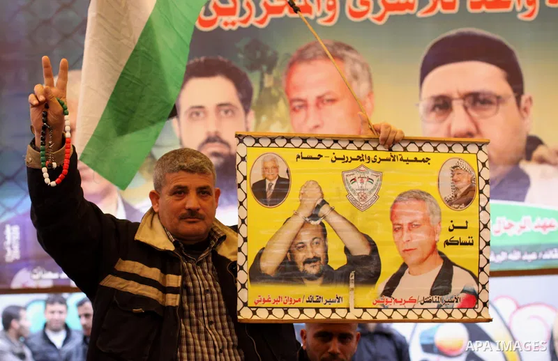Palestinians take part a protest demanding the release of their relatives prisoners held in Israeli jails, in front of the Red Cross office in Gaza City, on February 16, 2015. Photo by Mohammed Asad