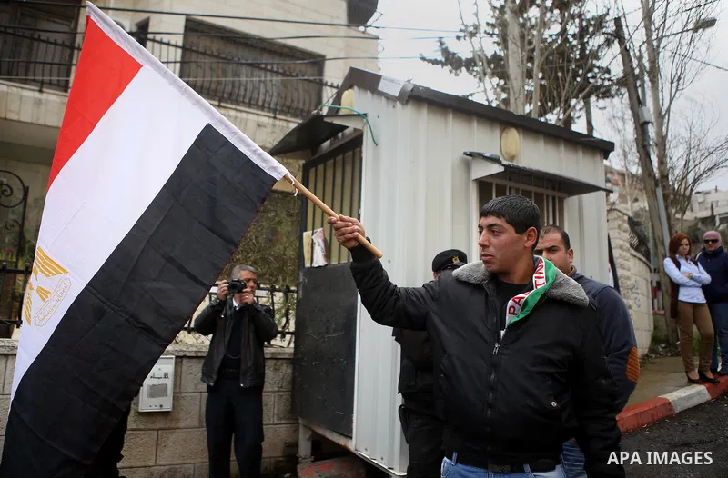 Palestinians take part in a protest against the murders of the Twenty-one Egyptians beheaded in Libya by the Islamic State (IS), in the West Bank city of Ramallah, on February 16, 2015. Islamic State released the video o...