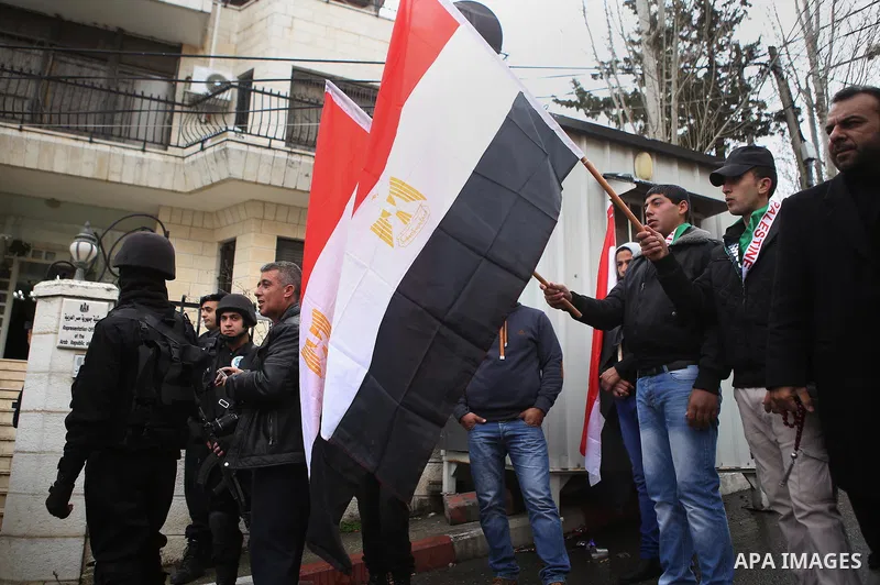 Palestinians take part in a protest against the murders of the Twenty-one Egyptians beheaded in Libya by the Islamic State (IS), in the West Bank city of Ramallah, on February 16, 2015. Islamic State released the video o...