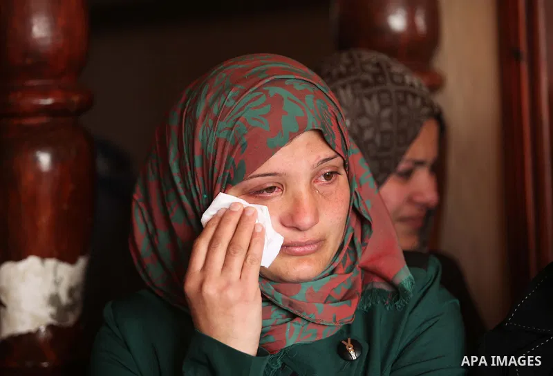 Relatives of Palestinian boy Izz eldeen Al-Kafarana, 9 months old, mourn during his funeral in Biet Hanoun in the northern Gaza Strip February 17, 2015. Palestinian health officials said Al-Kafarana died when fire erupte...