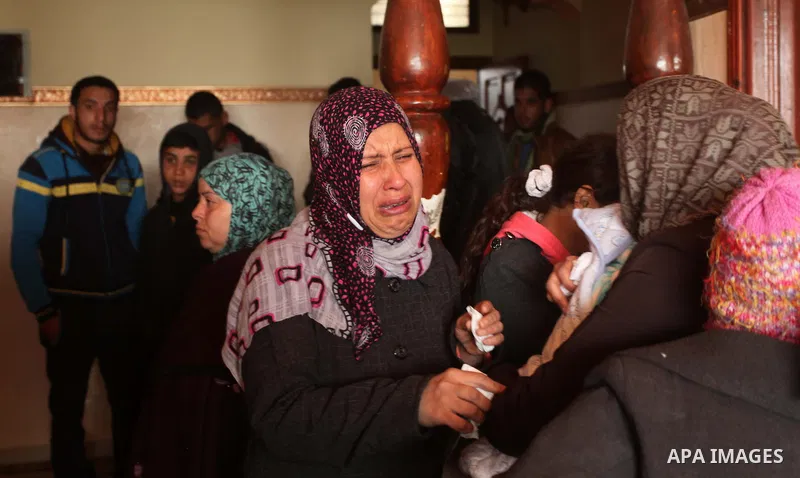 Relatives of Palestinian boy Izz eldeen Al-Kafarana, 9 months old, mourn during his funeral in Biet Hanoun in the northern Gaza Strip February 17, 2015. Palestinian health officials said Al-Kafarana died when fire erupte...