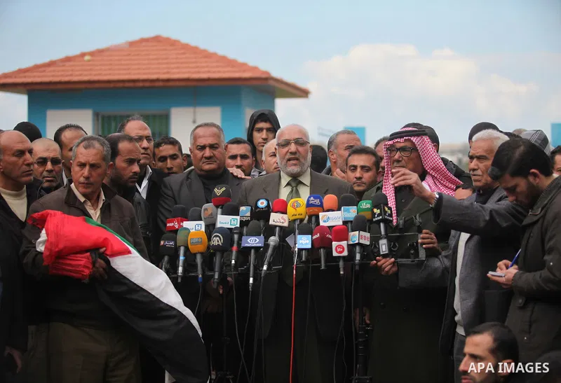 Head mayor of Beit Hanoun Mohammed Al-Kafarana, speaks during a funeral of Palestinian boy Izz eldeen Al-Kafarana, 9 months old, at a UN-run school where he died in Biet Hanoun in the northern Gaza Strip February 17, 201...