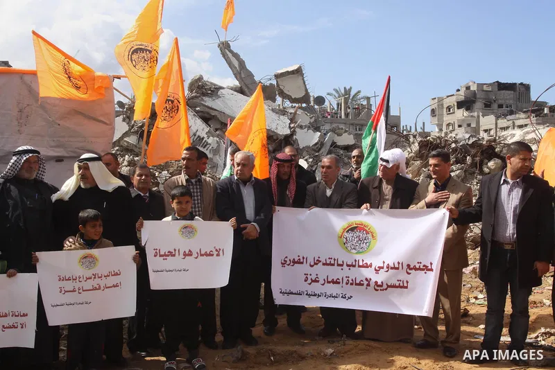 Palestinian owners of houses which were destroyed during the recent Israeli war, take part in a rally demanding for reconstruction of their houses, in Shejaiya neighborhood in Gaza city, February 17, 2015. At least 100,0...