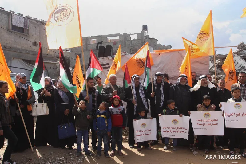Palestinian owners of houses which were destroyed during the recent Israeli war, take part in a rally demanding for reconstruction of their houses, in Shejaiya neighborhood in Gaza city, February 17, 2015. At least 100,0...