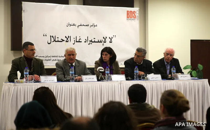 Member of the Central Committee of Fatah, Abbas Zaki, (2nd L), speaks during a press conference calling for boycott importing of Israeli gas, in the West Bank city of Ramallah February 17, 2015. . Photo by Shadi Hatem