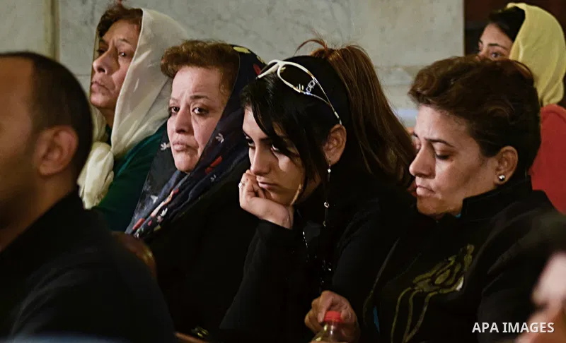 Egyptian Coptics attend a mass led by Egypt's Coptic Pope Tawadros II to honor the memory of the Egyptian Coptic Christians murdered by Islamic State (IS) group militants in Libya, at Saint-Mark's Coptic Cathedral in Cai...