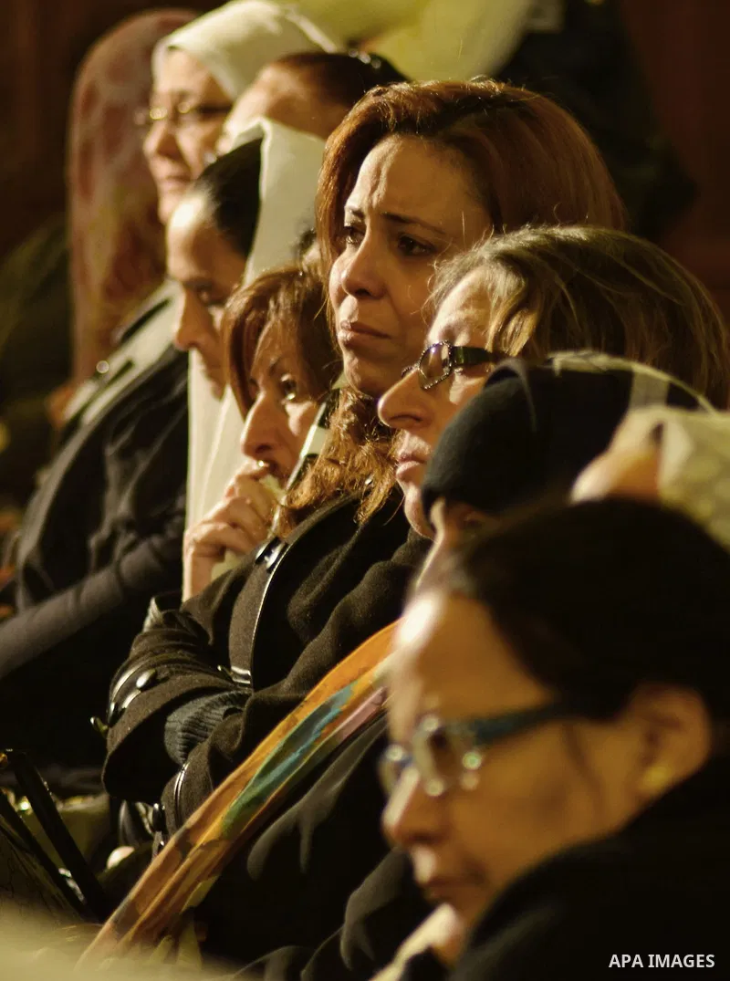 Egyptian Coptics attend a mass led by Egypt's Coptic Pope Tawadros II to honor the memory of the Egyptian Coptic Christians murdered by Islamic State (IS) group militants in Libya, at Saint-Mark's Coptic Cathedral in Cai...