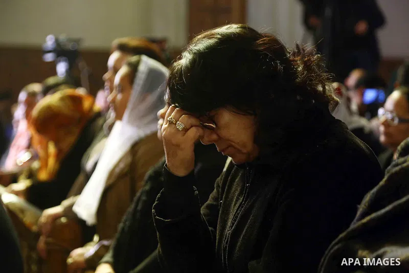 Egyptian Coptics attend a mass led by Egypt's Coptic Pope Tawadros II to honor the memory of the Egyptian Coptic Christians murdered by Islamic State (IS) group militants in Libya, at Saint-Mark's Coptic Cathedral in Cai...