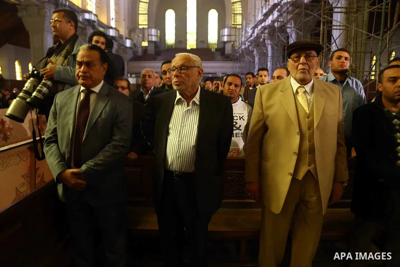 Egyptian Coptics attend a mass led by Egypt's Coptic Pope Tawadros II to honor the memory of the Egyptian Coptic Christians murdered by Islamic State (IS) group militants in Libya, at Saint-Mark's Coptic Cathedral in Cai...