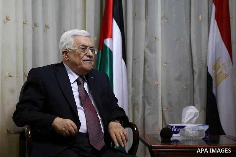 Palestinian President Mahmoud Abbas offers his condolences to the Egyptian Ambassador in Palestinian Authority Wael Atiya (not pictured), in the West Bank city of Ramallah February 17, 2015. Egyptian President Abdel Fatt...