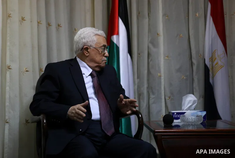 Palestinian President Mahmoud Abbas offers his condolences to the Egyptian Ambassador in Palestinian Authority Wael Atiya (not pictured), in the West Bank city of Ramallah February 17, 2015. Egyptian President Abdel Fatt...