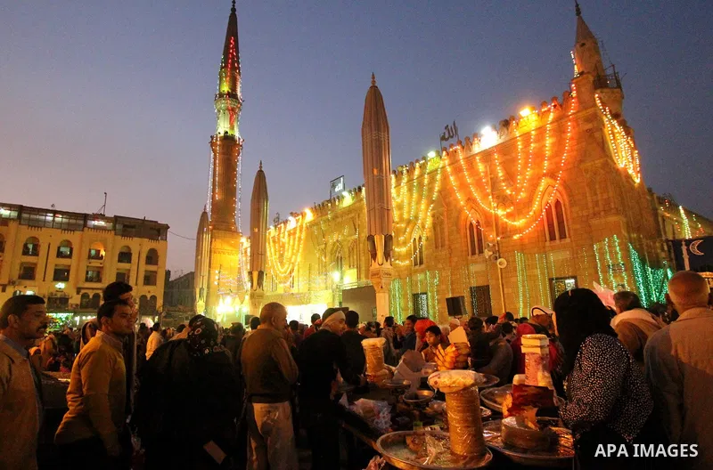 Egyptian worshippers attend a Mawlid al-Hussein, a religious celebration marking the birthday of the grandson of the Prophet Muhammad, in Cairo, Egypt, Tuesday, Feb. 17, 2015. The celebration is one of the largest in Egy...