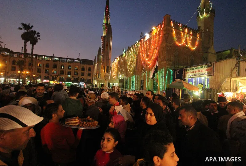 Egyptian worshippers attend a Mawlid al-Hussein, a religious celebration marking the birthday of the grandson of the Prophet Muhammad, in Cairo, Egypt, Tuesday, Feb. 17, 2015. The celebration is one of the largest in Egy...