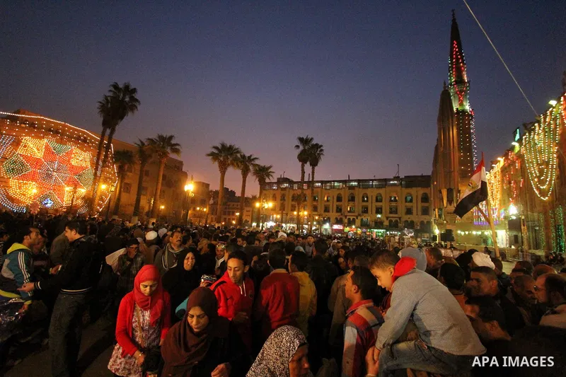 Egyptian worshippers attend a Mawlid al-Hussein, a religious celebration marking the birthday of the grandson of the Prophet Muhammad, in Cairo, Egypt, Tuesday, Feb. 17, 2015. The celebration is one of the largest in Egy...