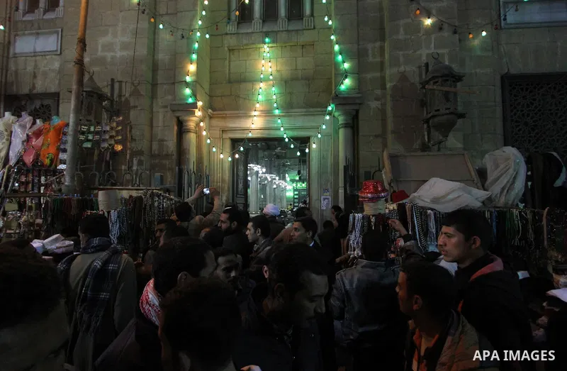 Egyptian worshippers attend a Mawlid al-Hussein, a religious celebration marking the birthday of the grandson of the Prophet Muhammad, in Cairo, Egypt, Tuesday, Feb. 17, 2015. The celebration is one of the largest in Egy...