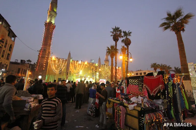 Egyptian worshippers attend a Mawlid al-Hussein, a religious celebration marking the birthday of the grandson of the Prophet Muhammad, in Cairo, Egypt, Tuesday, Feb. 17, 2015. The celebration is one of the largest in Egy...