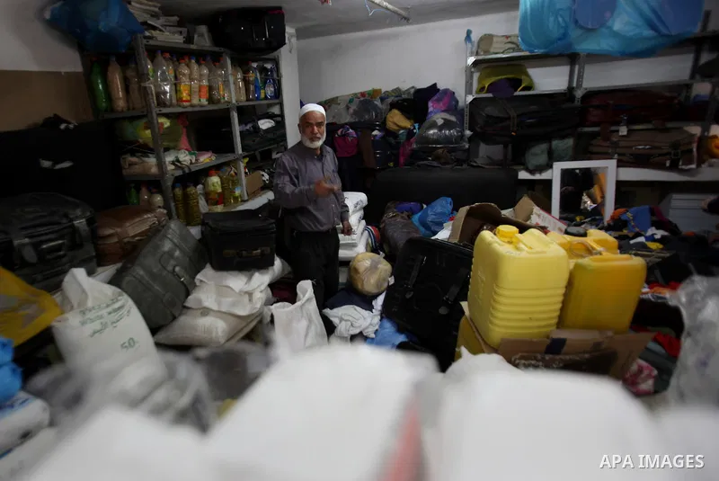 A Palestinian man inspects the damages at his house after an Israeli military operation, in the West Bank village of Yatma south of Nablus Feb. 18, 2015. Israeli troops stormed three Palestinian villages in Nablus distri...