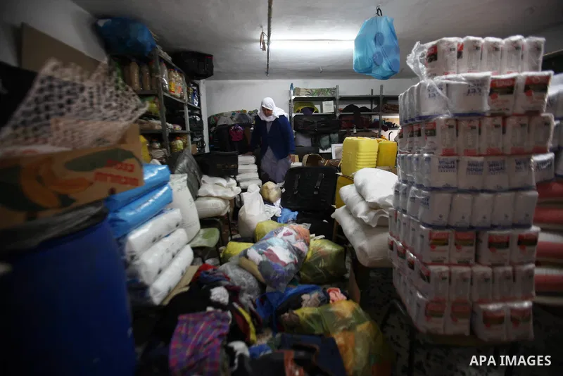 A Palestinian woman inspects the damages at her house after an Israeli military operation, in the West Bank village of Yatma south of Nablus Feb. 18, 2015. Israeli troops stormed three Palestinian villages in Nablus dist...