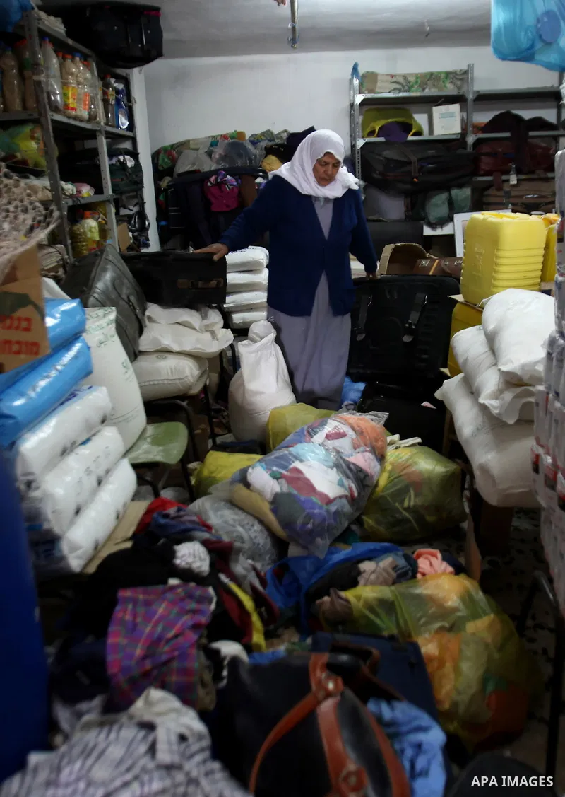 A Palestinian woman inspects the damages at her house after an Israeli military operation, in the West Bank village of Yatma south of Nablus Feb. 18, 2015. Israeli troops stormed three Palestinian villages in Nablus dist...