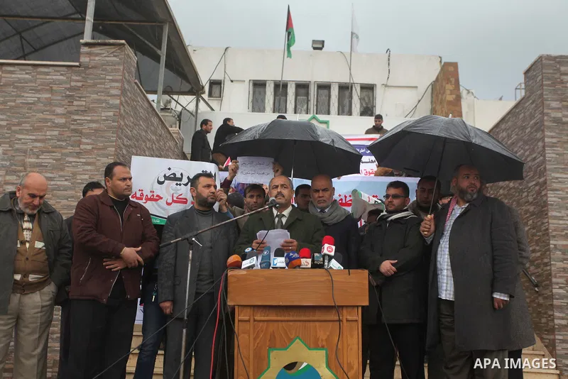Former head of the union staff in Gaza, Mohammed Siam speaks during a protest demanding their salaries to be paid, in front of the Legislative Council in Gaza city on February 18, 2015. Some 40,000 civil servants employe...