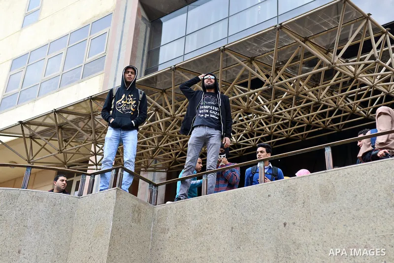 Egyptian students who are support ousted President Mohamed Morsi and the Muslim Brotherhood shout slogans during protest against the military rule, in Cairo University on February 18, 2015. Due to the escalation of stude...