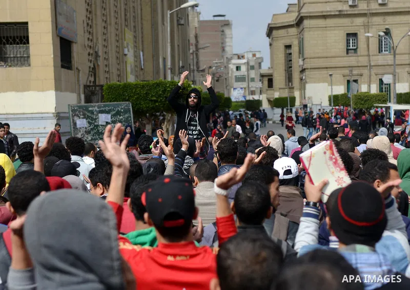 Egyptian students who are support ousted President Mohamed Morsi and the Muslim Brotherhood shout slogans during protest against the military rule, in Cairo University on February 18, 2015. Due to the escalation of stude...