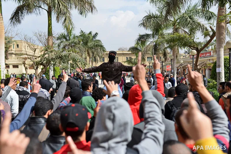 Egyptian students who are support ousted President Mohamed Morsi and the Muslim Brotherhood shout slogans during protest against the military rule, in Cairo University on February 18, 2015. Due to the escalation of stude...