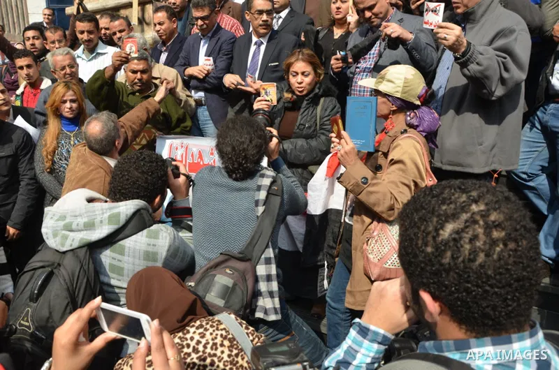 Egyptian journalists take part in a demonstration outside their syndicate against the beheading of 21 Egyptian Coptic Christians by Islamic State (IS) group jihadists on a beach in Libya, in Cairo on February 18, 2015. E...