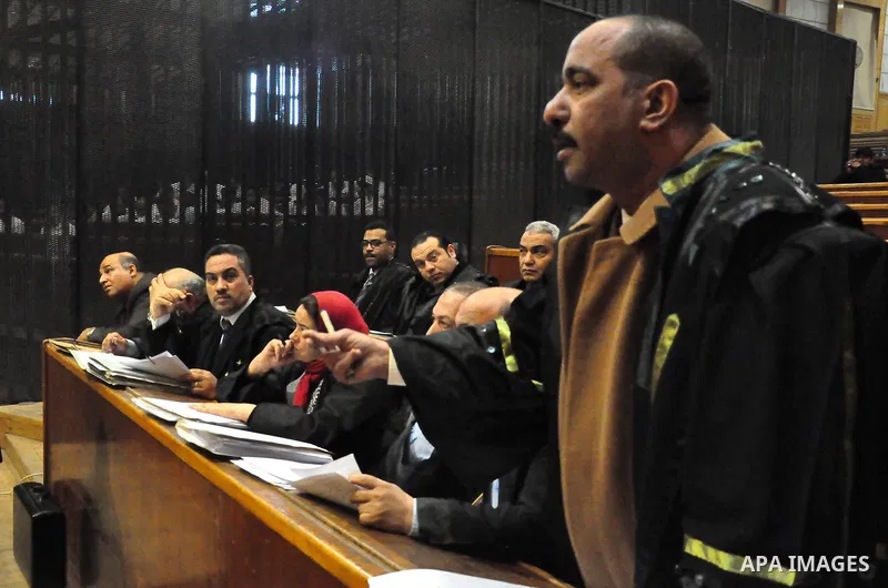 A lawyer speaks to judges during the trial of suspects in the 'Port Said Massacre' case in Cairo on February 21, 2015. The defendants were originally given sentences ranging from 15 years to life in prison. They were con...