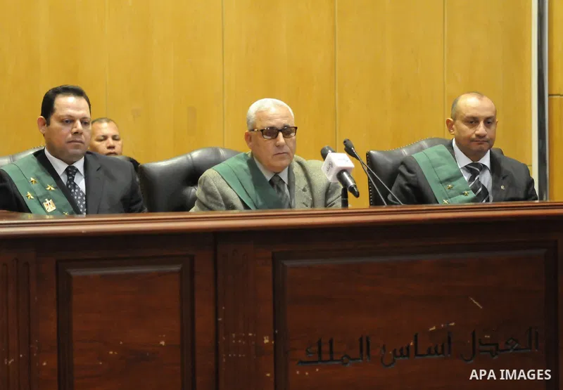 The Judges attend the trial of suspects in the 'Port Said Massacre' case in Cairo on February 21, 2015. The defendants were originally given sentences ranging from 15 years to life in prison. They were convicted of the m...