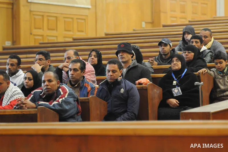 Relative of a killed men in the 'Port Said Massacre' attend a trial of suspects in Cairo on February 21, 2015. The defendants were originally given sentences ranging from 15 years to life in prison. They were convicted o...