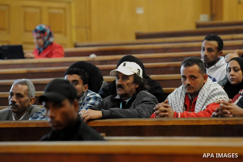 Relative of a killed men in the 'Port Said Massacre' attend a trial of suspects in Cairo on February 21, 2015. The defendants were originally given sentences ranging from 15 years to life in prison. They were convicted o...