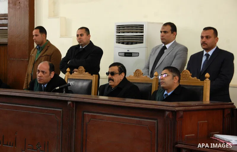 The Judges attend the trial of suspects in the "Rabaa Operation Room" case, in Cairo on February 12, 2015. The prosecution accused the defendants of several charges relating to preparation of an operation room to guide t...