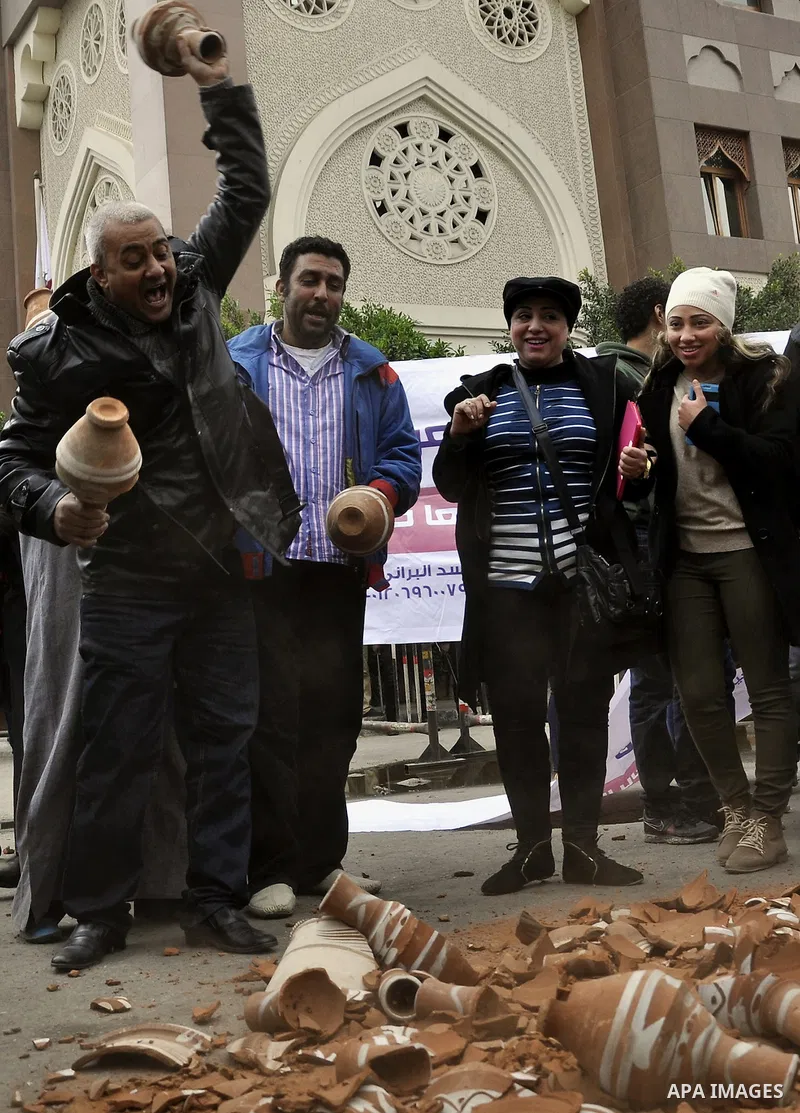 Egyptians take part during a protest in front of the Qatari embassy during a demonstration in Cairo, Egypt, 21 February 2015. Several people protested outside Qatar's embassy, after Qatar received backing a few days earl...