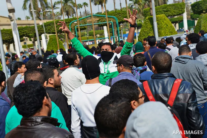 Egyptian students who are support ousted President Mohamed Morsi and the Muslim Brotherhood shout slogans during protest against the military rule, in Cairo University on February 22, 2015. Due to the escalation of stude...