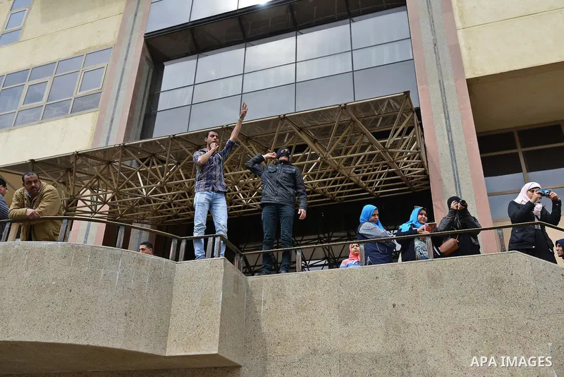 Egyptian students who are support ousted President Mohamed Morsi and the Muslim Brotherhood shout slogans during protest against the military rule, in Cairo University on February 22, 2015. Due to the escalation of stude...