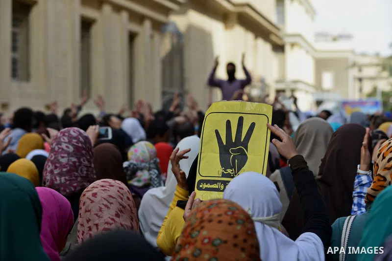 Egyptian students who are support ousted President Mohamed Morsi and the Muslim Brotherhood shout slogans during protest against the military rule, in Cairo University on February 22, 2015. Due to the escalation of stude...