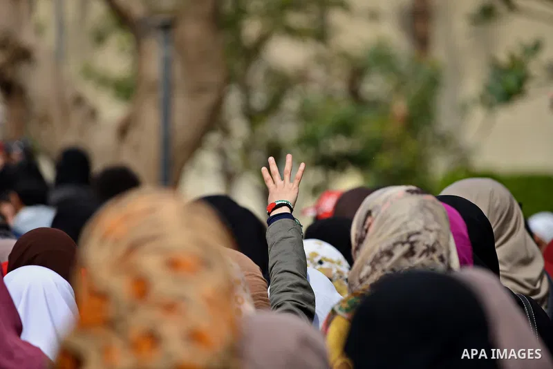 An Egyptian student who support ousted President Mohamed Morsi and the Muslim Brotherhood, flashes Rabaa sign during protest against the military rule, in Cairo University on February 22, 2015. Due to the escalation of s...