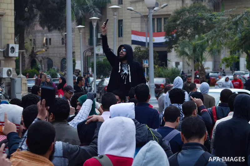 Egyptian students who are support ousted President Mohamed Morsi and the Muslim Brotherhood shout slogans during protest against the military rule, in Cairo University on February 22, 2015. Due to the escalation of stude...