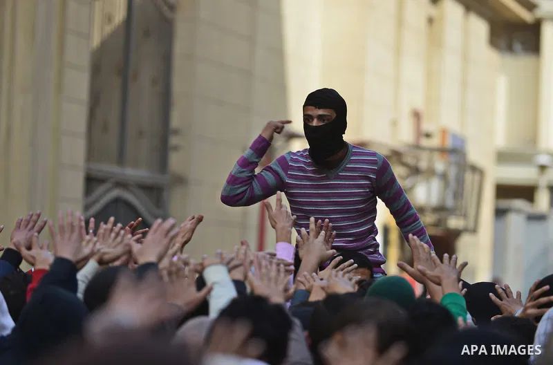 Egyptian students who are support ousted President Mohamed Morsi and the Muslim Brotherhood shout slogans during protest against the military rule, in Cairo University on February 22, 2015. Due to the escalation of stude...