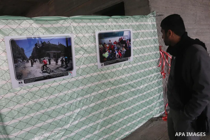 A Palestinian man participates in the photo gallery, in Gaza city on February 23, 2015. Photo by Mohammed Asad