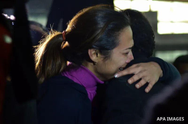 Relatives and supporters of Egyptian activist Alaa Abdel Fattah react after the verdict in his trial at a police institute in Cairo's Tora prison on February 23, 2015. Fattah, a leading dissident in the 2011 uprising tha...