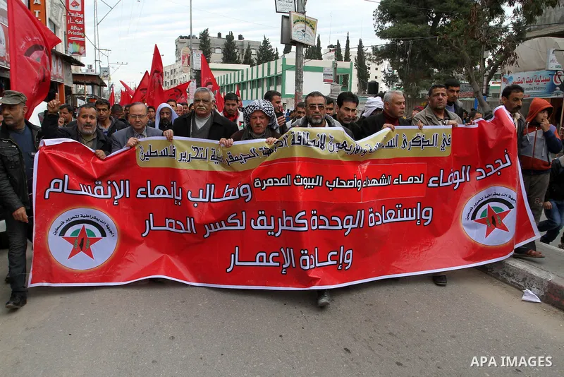Palestinians chant slogans during a rally marking the 46th anniversary of the founding of the Democratic Front for the Liberation of Palestine (DFLP), in Rafah in the southern Gaza Strip February 23, 2015. Photo by Abed...