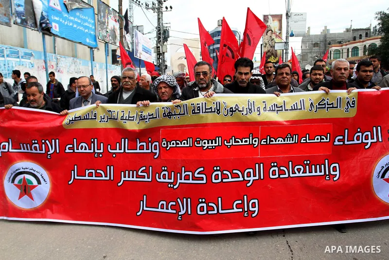 Palestinians chant slogans during a rally marking the 46th anniversary of the founding of the Democratic Front for the Liberation of Palestine (DFLP), in Rafah in the southern Gaza Strip February 23, 2015. Photo by Abed...